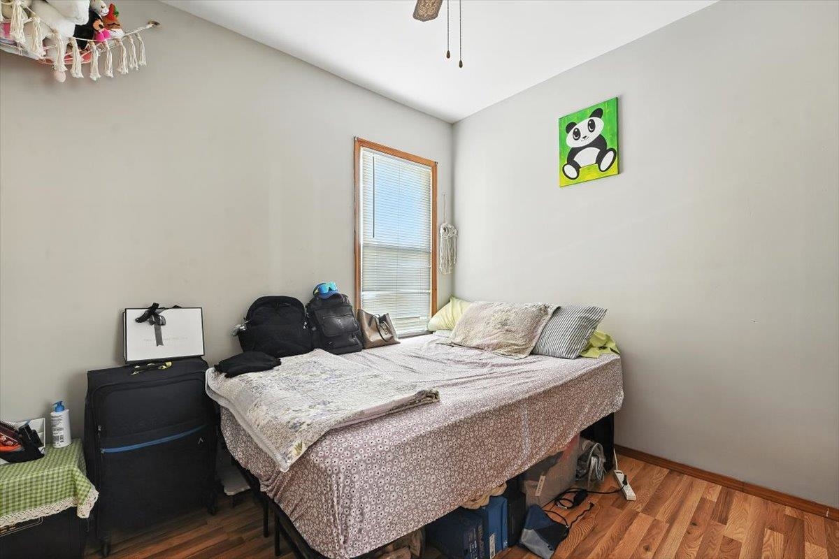 175 Van Winkle Avenue, Unit 1 Jersey City, NJ 07306 - Photo 11 of 14 a bedroom with a bed and painting on the wall