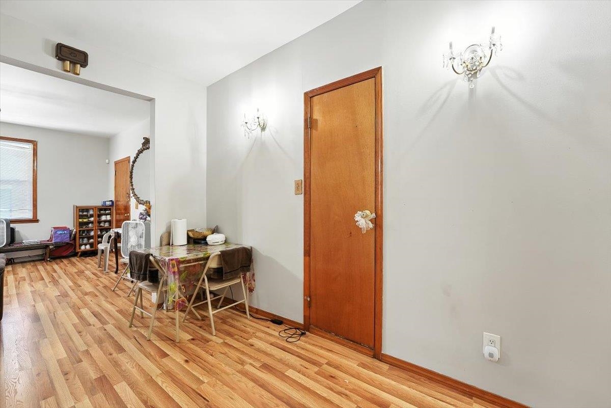 175 Van Winkle Avenue, Unit 1 Jersey City, NJ 07306 - Photo 6 of 14 a living room with furniture and a wooden floor