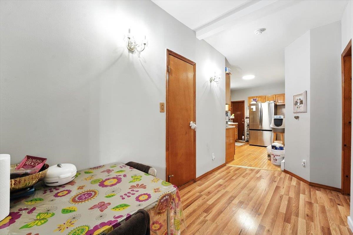 175 Van Winkle Avenue, Unit 1 Jersey City, NJ 07306 - Photo 7 of 14 a bedroom with a bed and wooden floor