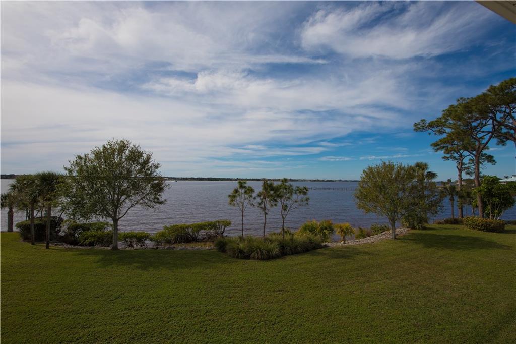 2174 Northwest Plumbago Trail Stuart, FL 34994 - Photo 13 of 26 a view of a golf course with a lake