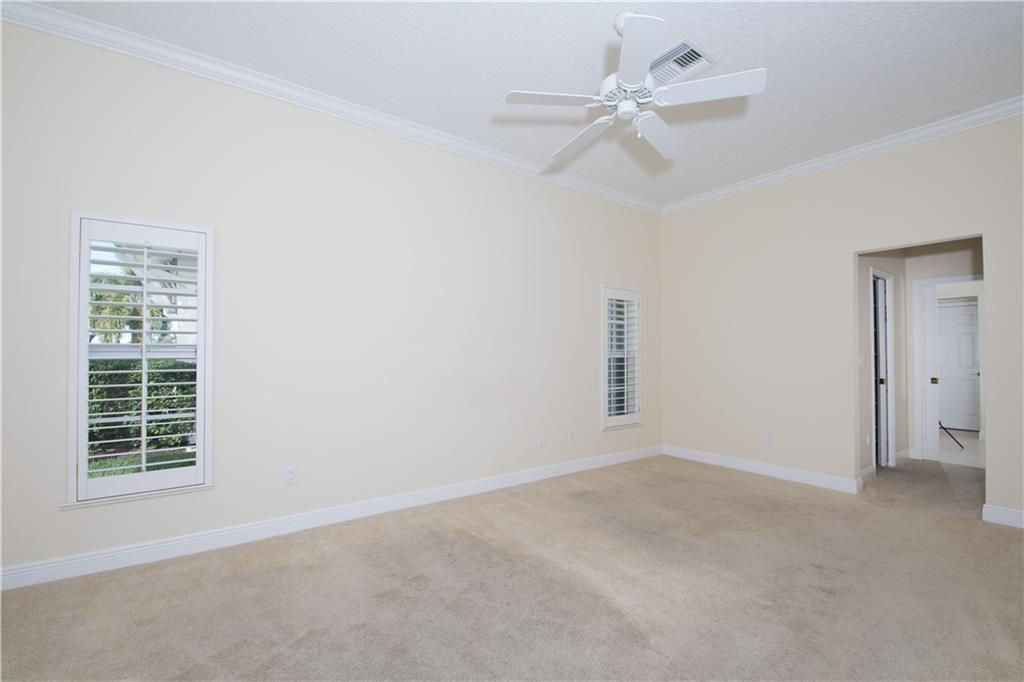 2174 Northwest Plumbago Trail Stuart, FL 34994 - Photo 15 of 26 a view of an empty room with a window