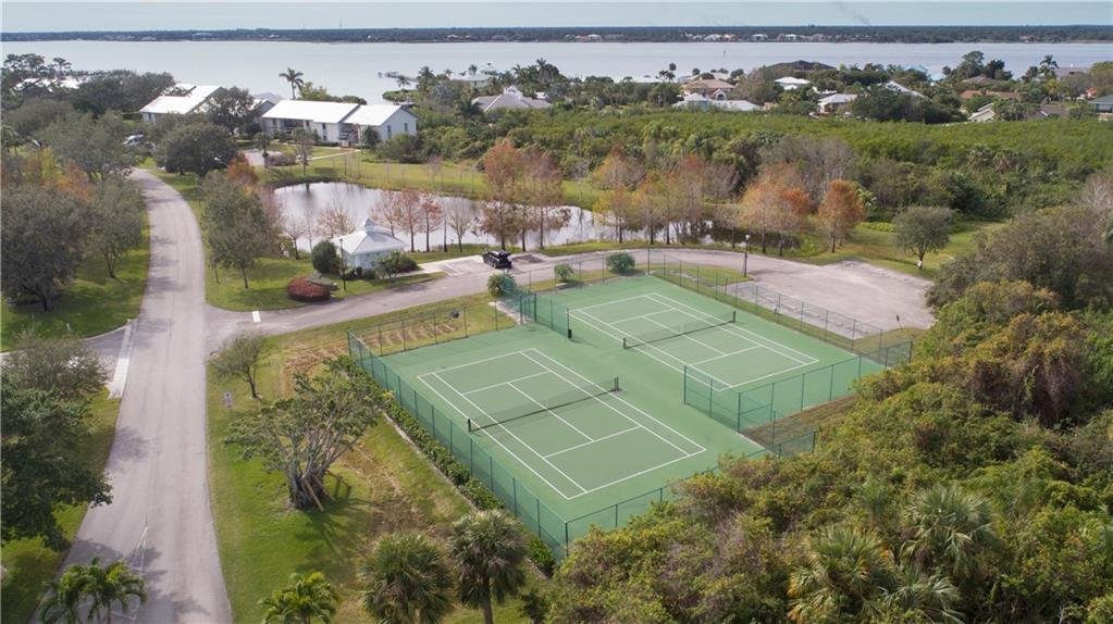 2174 Northwest Plumbago Trail Stuart, FL 34994 - Photo 20 of 26 an aerial view of a house with a yard