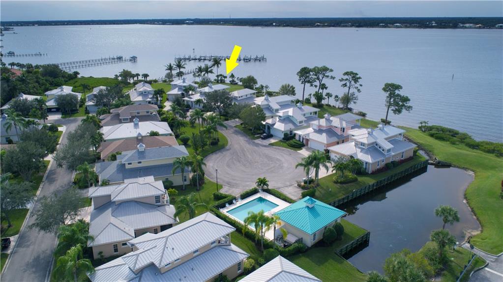 2174 Northwest Plumbago Trail Stuart, FL 34994 - Photo 24 of 26 an aerial view of a house with a yard and lake view