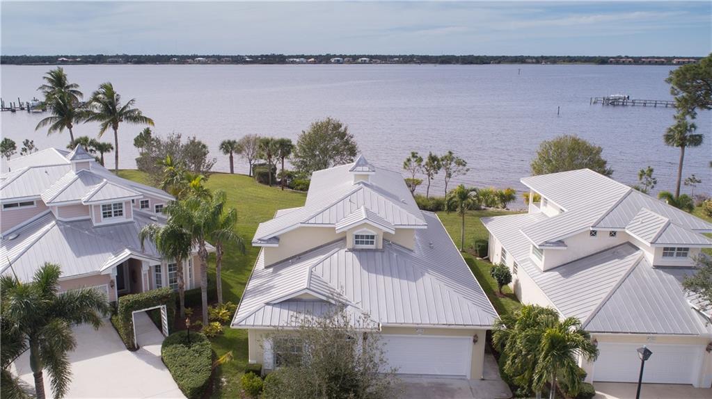 2174 Northwest Plumbago Trail Stuart, FL 34994 - Photo 5 of 26 an aerial view of multiple houses with yard