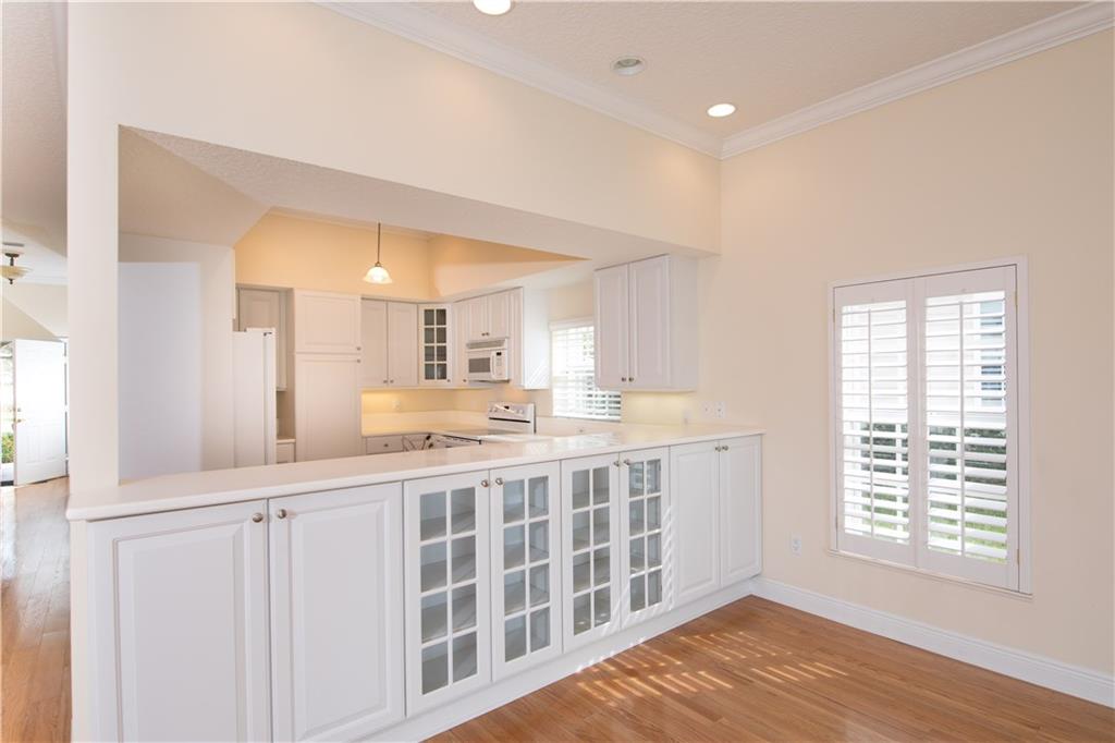 2174 Northwest Plumbago Trail Stuart, FL 34994 - Photo 9 of 26 a spacious bathroom with a double vanity sink and a mirror