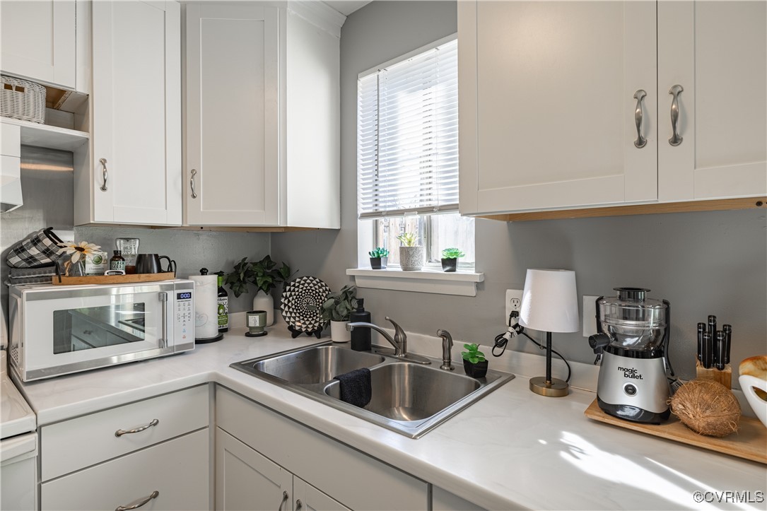 1801 Beaver Road Highland Springs, VA 23075 - Photo 17 of 28 Kitchen with sink and white cabinets