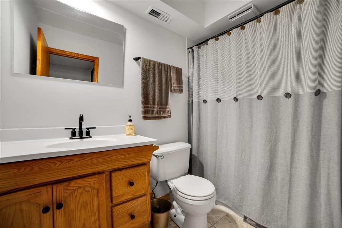 14511 Central Court, Unit M2 Oak Forest, IL 60452 - Photo 17 of 38 a bathroom with a sink a toilet and shower