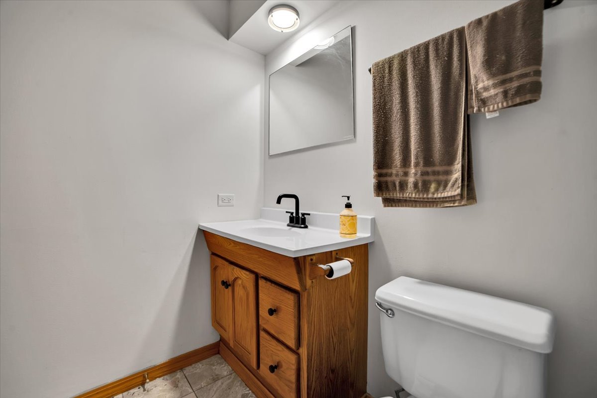 14511 Central Court, Unit M2 Oak Forest, IL 60452 - Photo 18 of 38 a bathroom with a sink a toilet and a mirror