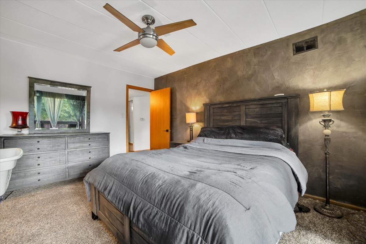 14511 Central Court, Unit M2 Oak Forest, IL 60452 - Photo 20 of 38 a bedroom with a large bed and a chandelier