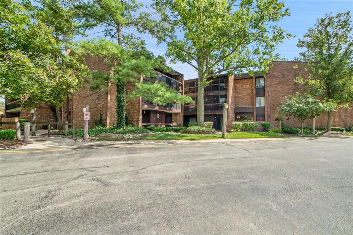 14511 Central Court, Unit M2 Oak Forest, IL 60452 - Photo 3 of 38 front view of a house with a tree and a yard