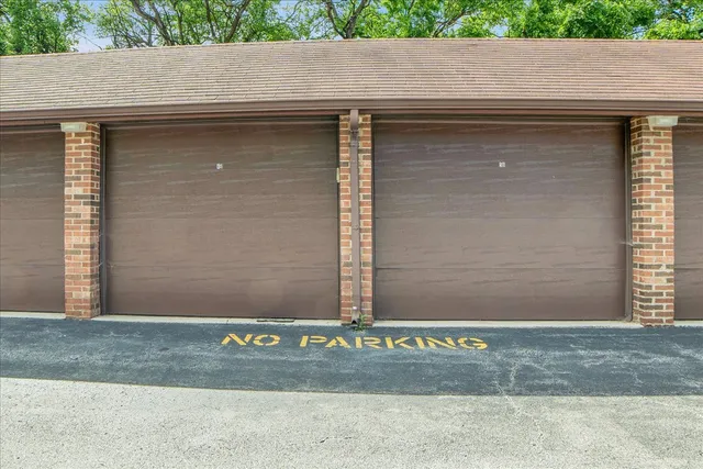 a view of backyard with swimming pool and green space