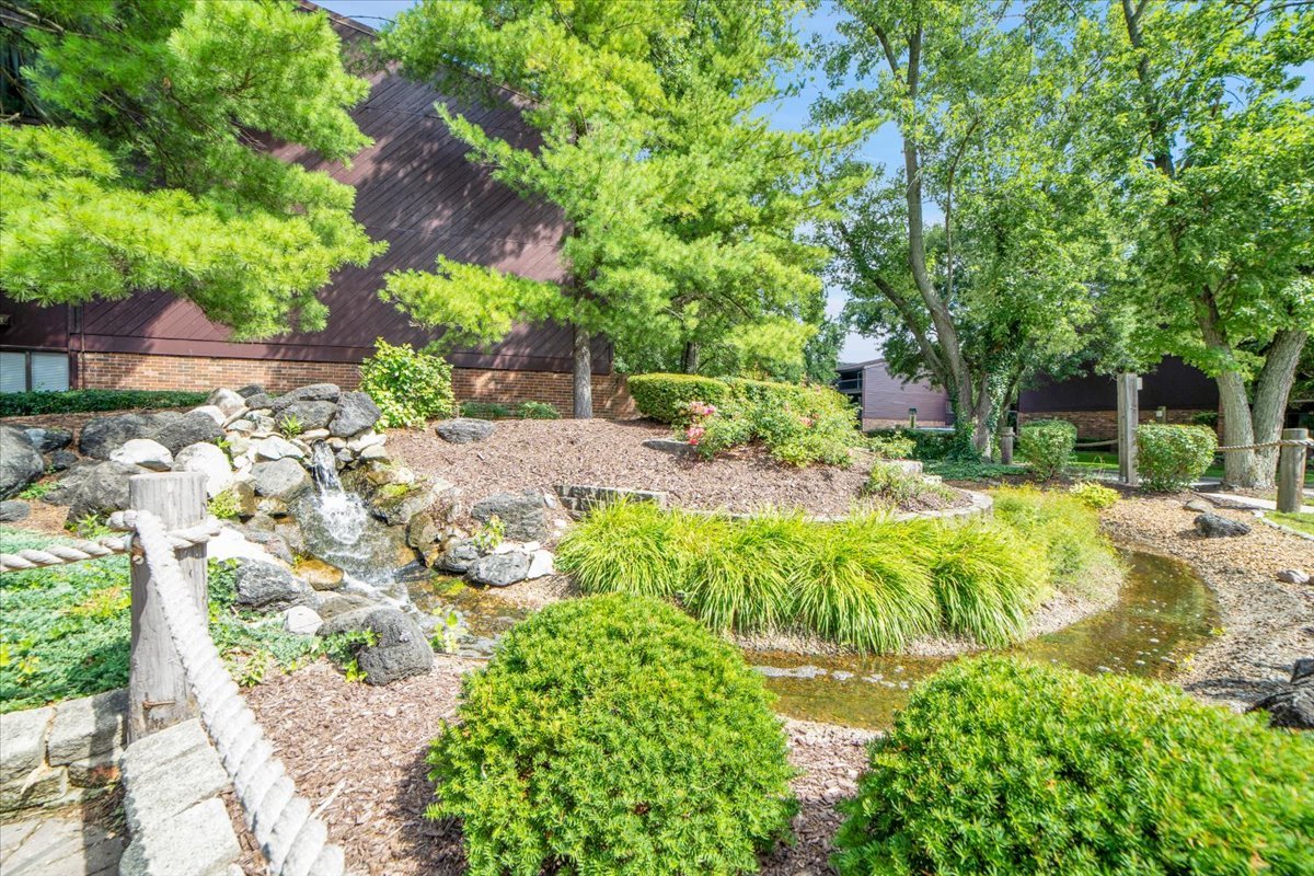 14511 Central Court, Unit M2 Oak Forest, IL 60452 - Photo 33 of 38 a view of backyard with swimming pool and green space