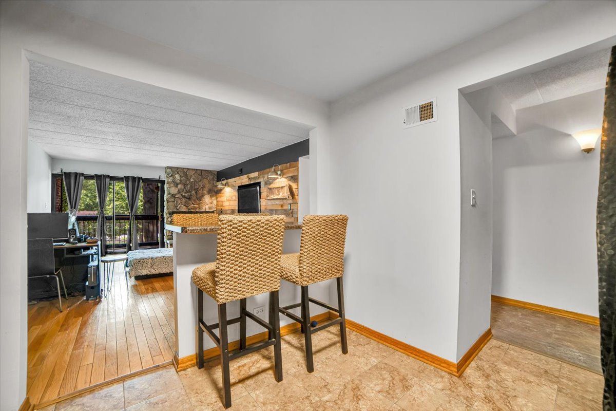 14511 Central Court, Unit M2 Oak Forest, IL 60452 - Photo 10 of 38 a dining room with furniture and wooden floor