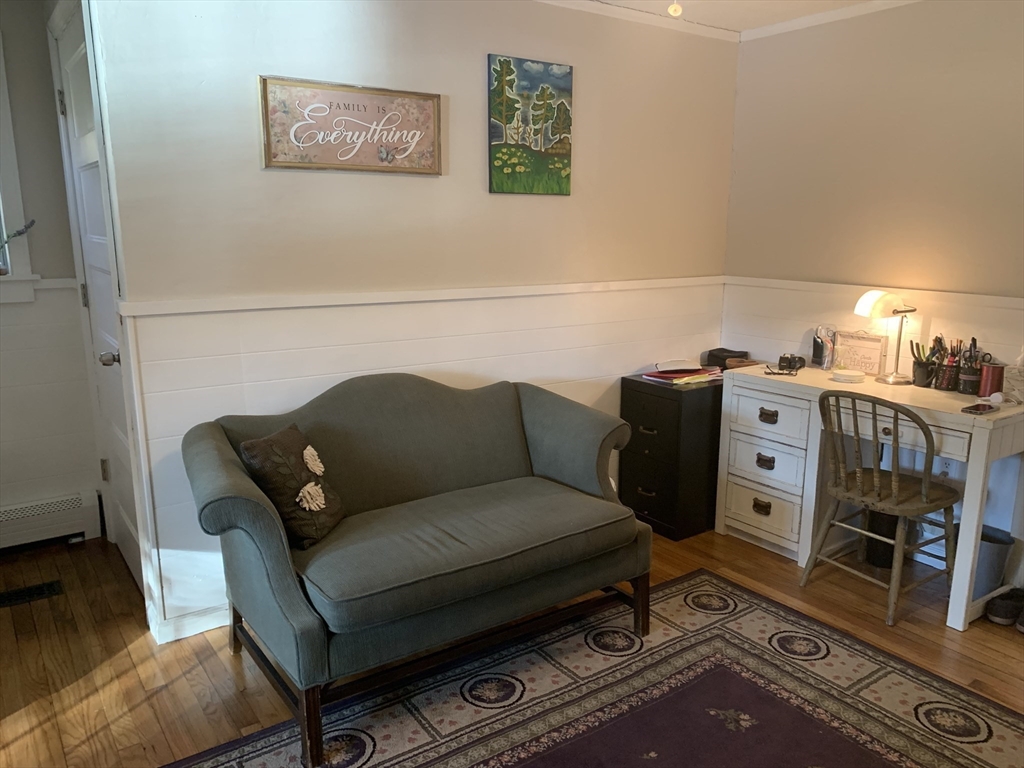 21 Sullivan Road Charlton, MA 01507 - Photo 18 of 35 a living room with furniture a wooden floor and next to a window
