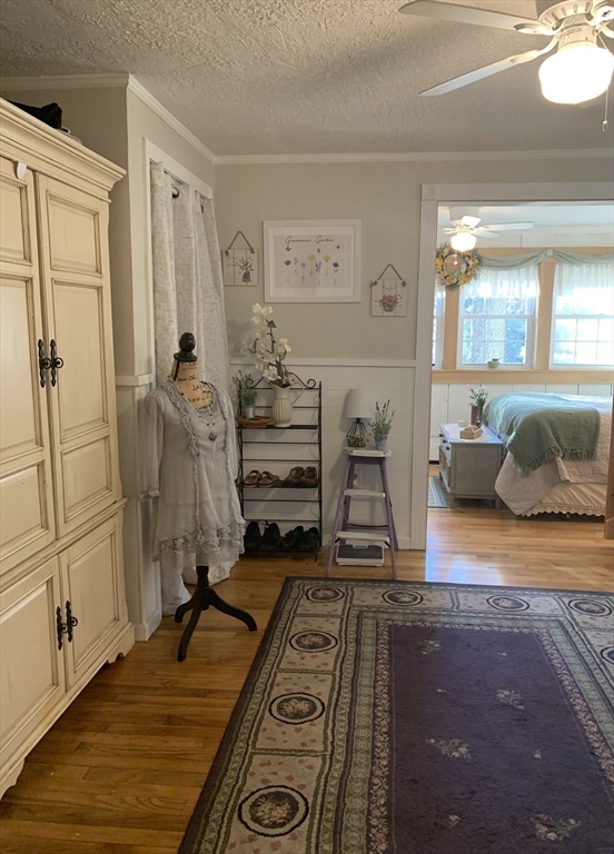 21 Sullivan Road Charlton, MA 01507 - Photo 19 of 35 a bedroom with a bed and wooden floor
