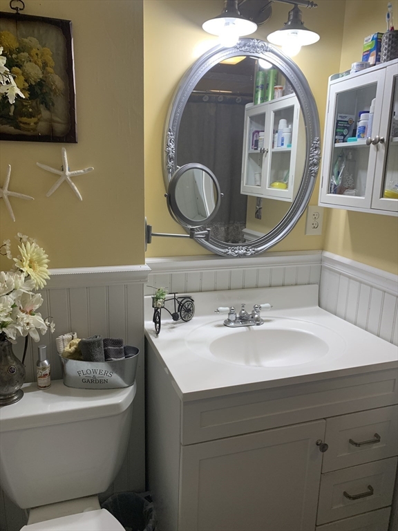 21 Sullivan Road Charlton, MA 01507 - Photo 23 of 35 a bathroom with a sink and a mirror