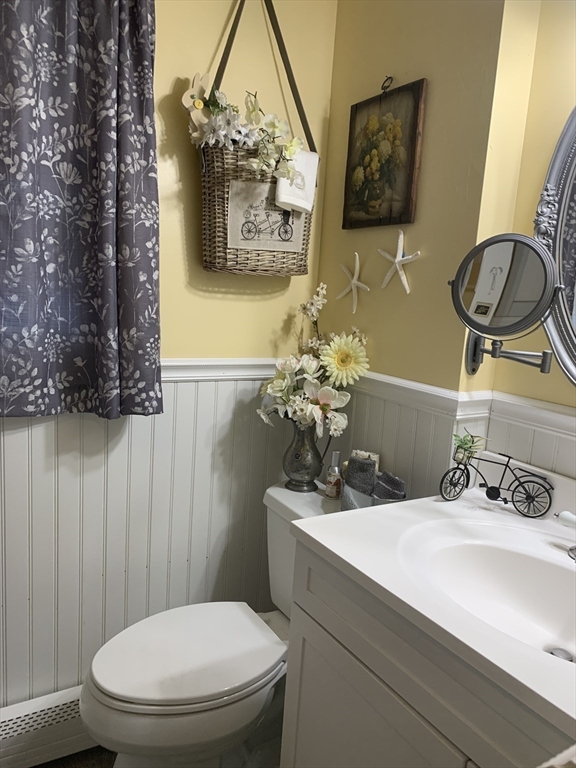 21 Sullivan Road Charlton, MA 01507 - Photo 25 of 35 a bathroom with a toilet a sink and mirror