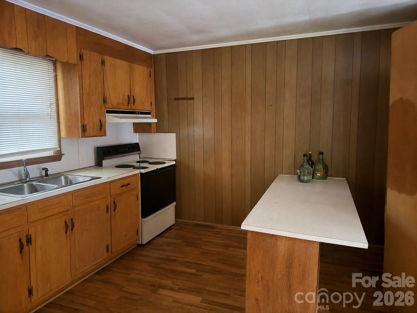 405 Isom Street Lancaster, SC 29720 - Photo 5 of 8 a kitchen with stainless steel appliances a sink a microwave a refrigerator and cabinets