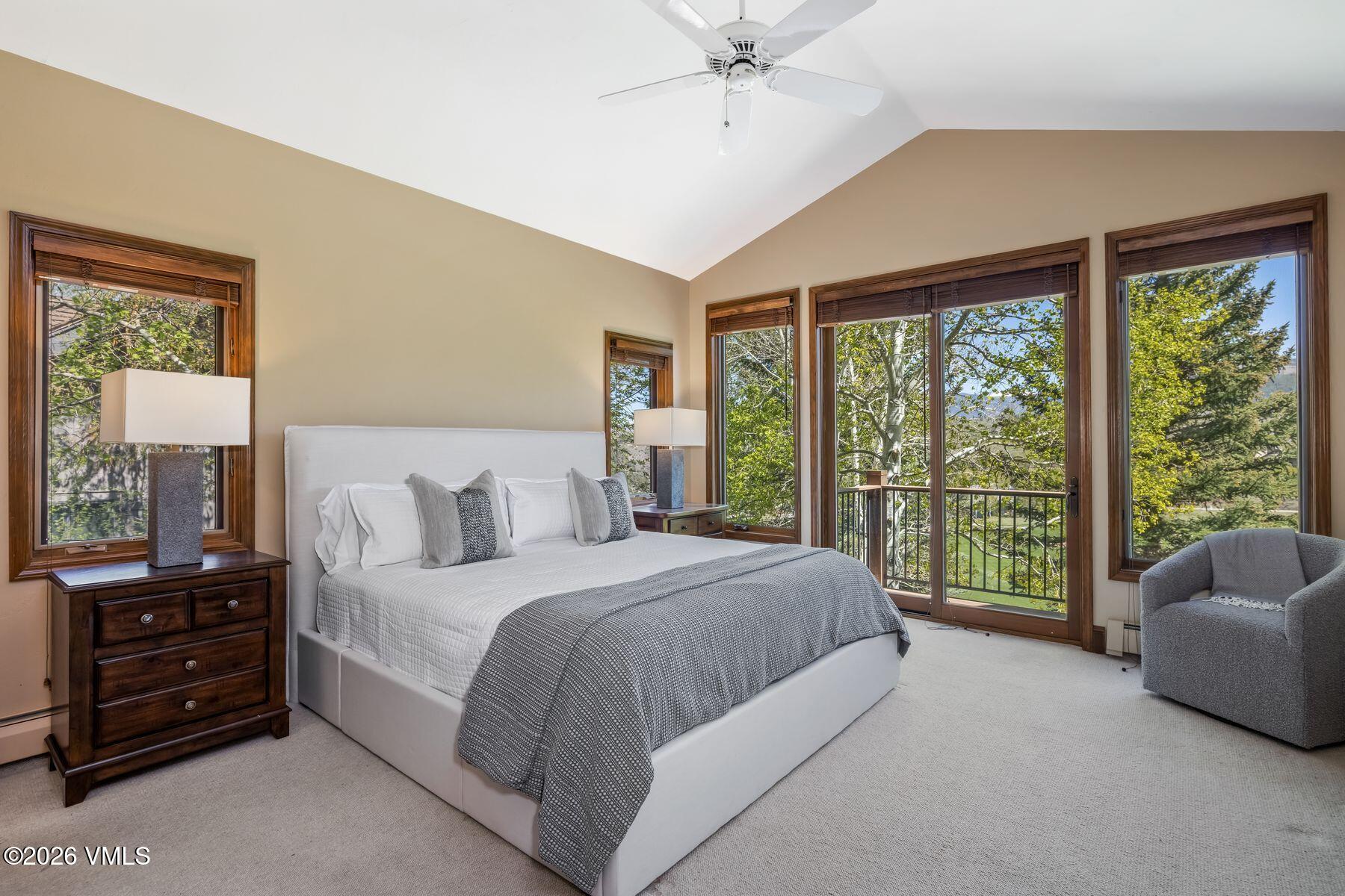 167 Saddle Ridge Edwards, CO 81632 - Photo 17 of 41 a bedroom with a bed and a chandelier