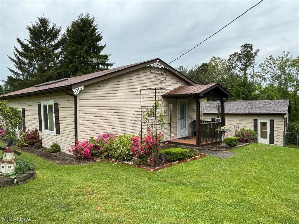 2417 Mc Adoo Ridge Road Wellsburg, WV 26070 - Photo 26 of 33 Back of house featuring a lawn