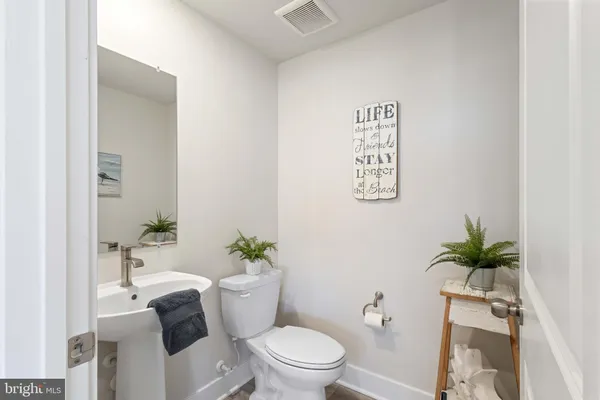 a white tub sitting next to a white toilet