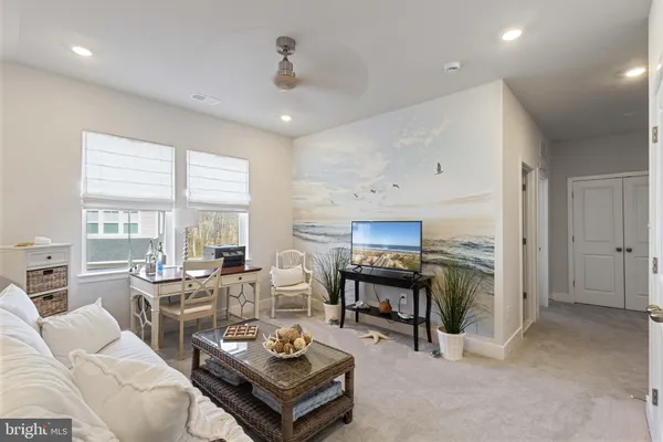 a living room with furniture and a large window