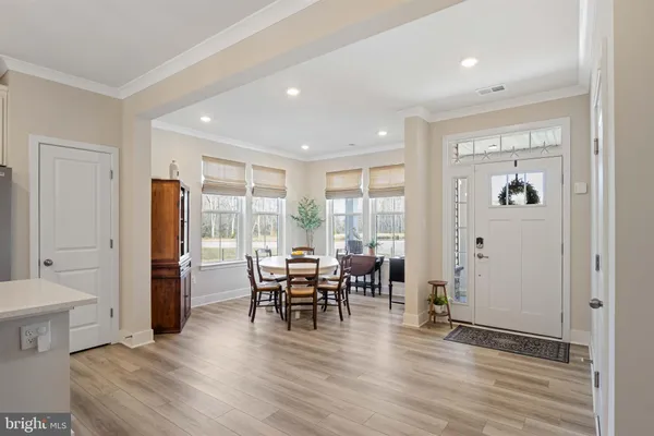 a view of a livingroom with furniture window and wooden floor