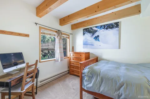 a bedroom with furniture and windows