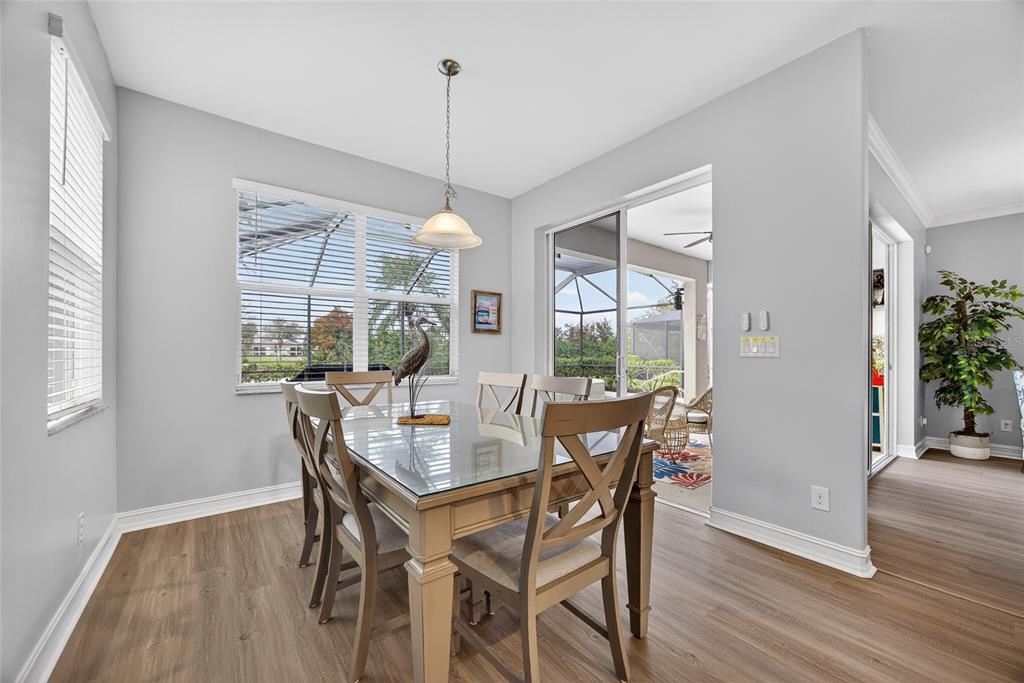 25187 Keygrass Court Punta Gorda, FL 33955 - Photo 18 of 54 a dining room with furniture window wooden floor