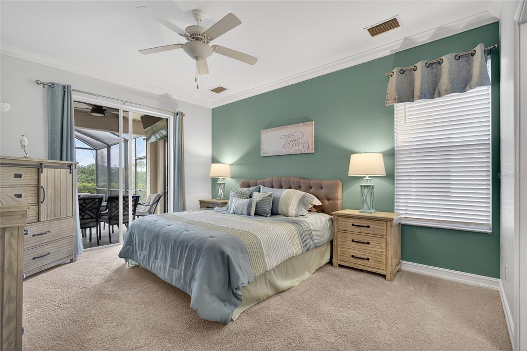 25187 Keygrass Court Punta Gorda, FL 33955 - Photo 19 of 54 a bedroom with a bed dresser and a window