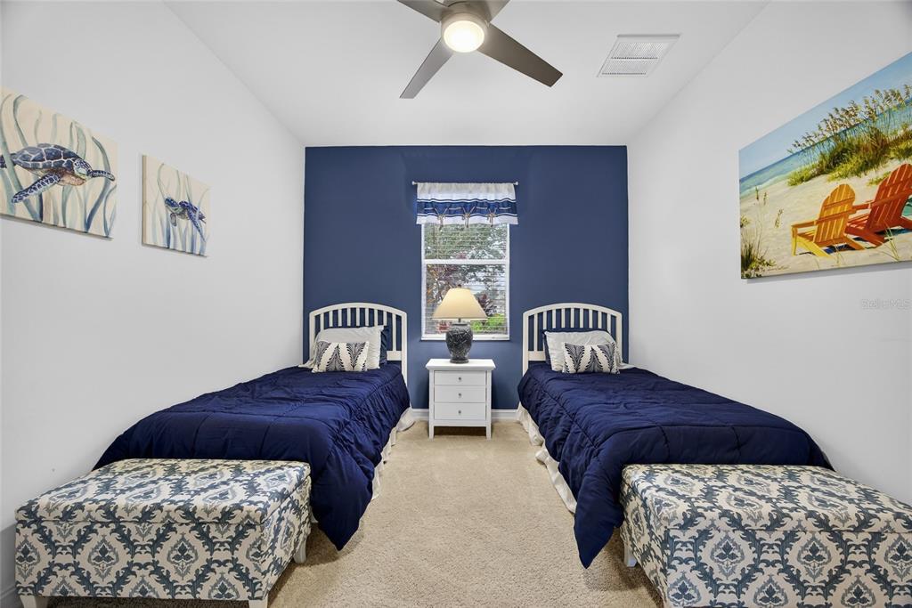 25187 Keygrass Court Punta Gorda, FL 33955 - Photo 25 of 54 a bedroom with a bed and a painting on the wall