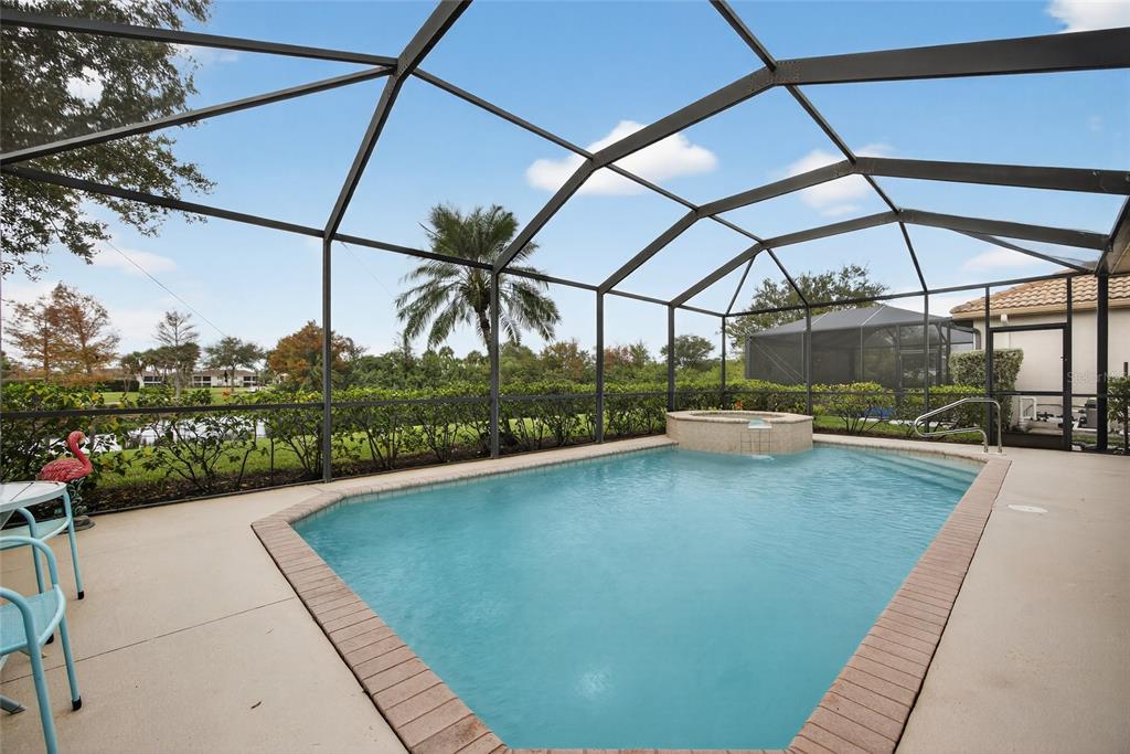 25187 Keygrass Court Punta Gorda, FL 33955 - Photo 26 of 54 a view of a swimming pool with a porch