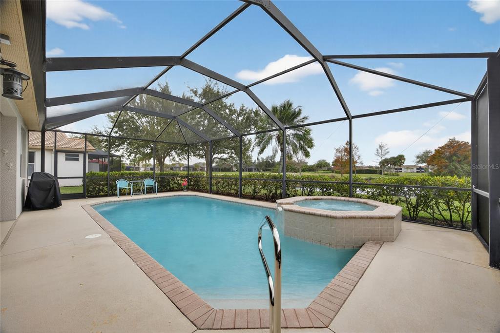 25187 Keygrass Court Punta Gorda, FL 33955 - Photo 28 of 54 a view of a swimming pool with a porch