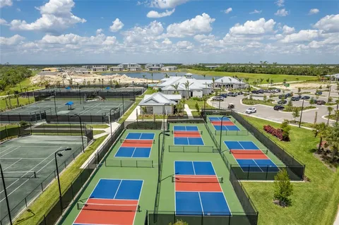 a view of a livingroom with furniture and a book shelf