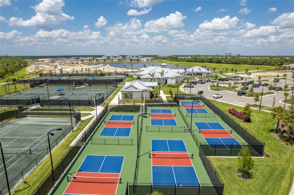 25187 Keygrass Court Punta Gorda, FL 33955 - Photo 49 of 54 a multi story swimming pool that has lawn chairs