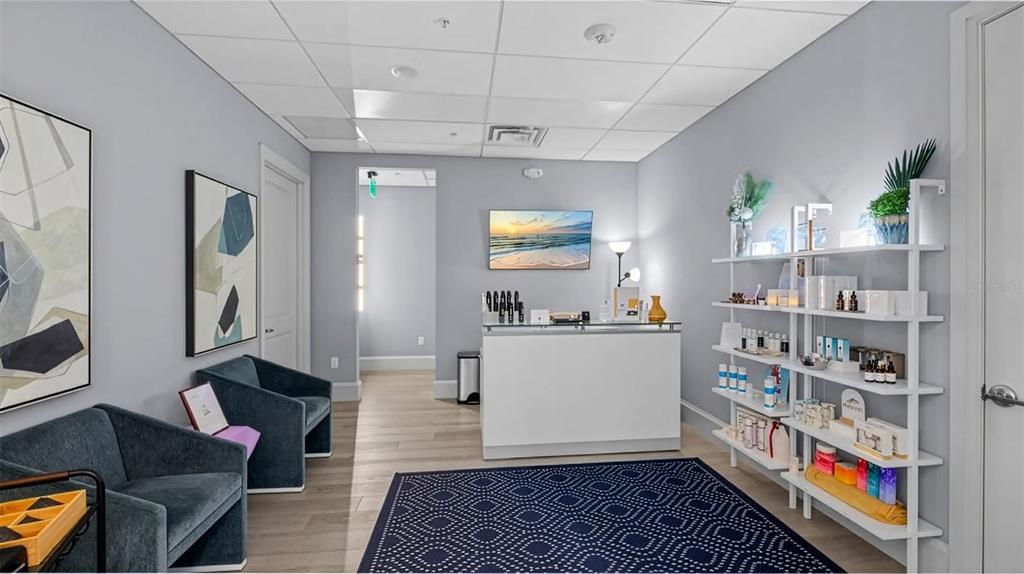 25187 Keygrass Court Punta Gorda, FL 33955 - Photo 52 of 54 a living room with furniture and a book shelf