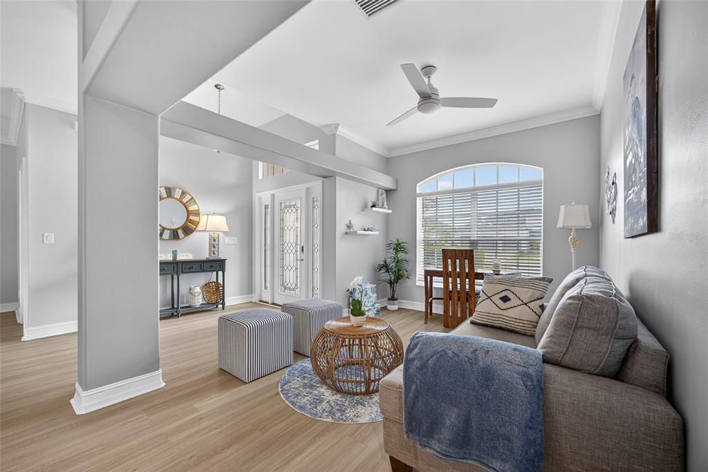 25187 Keygrass Court Punta Gorda, FL 33955 - Photo 6 of 54 a living room with furniture and a fireplace