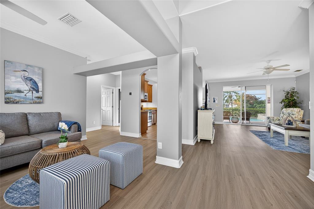 25187 Keygrass Court Punta Gorda, FL 33955 - Photo 8 of 54 a living room with furniture and a wooden floor