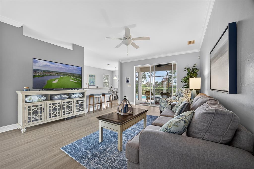 25187 Keygrass Court Punta Gorda, FL 33955 - Photo 10 of 54 a living room with furniture and a flat screen tv