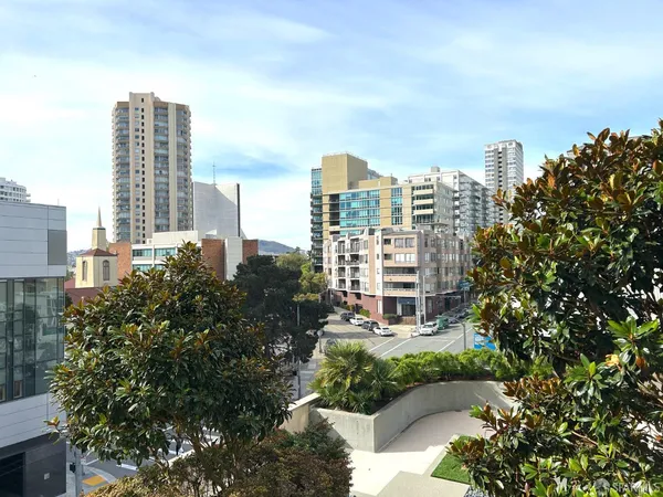 a view of a city with tall buildings in the background