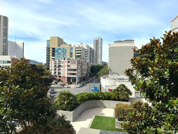 a view of a city with tall buildings