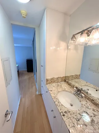 a bathroom with a sink and a mirror