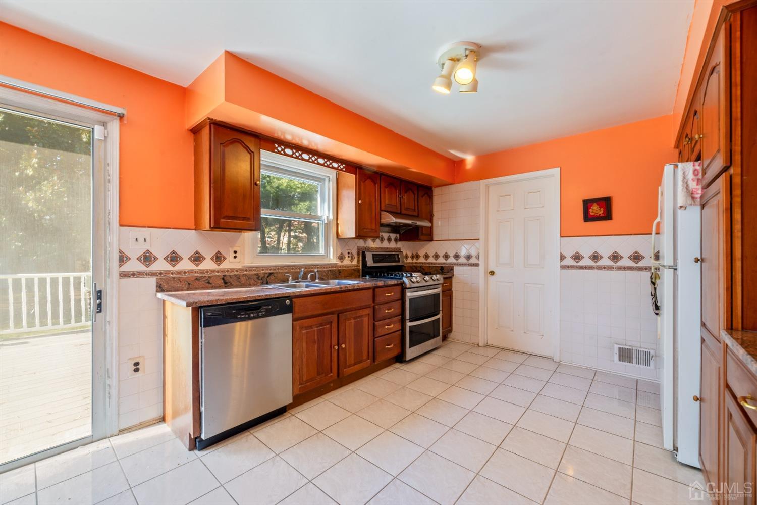 7 Prescott Road East Brunswick, NJ 08816 - Photo 11 of 30 a kitchen with stainless steel appliances granite countertop a refrigerator and a stove
