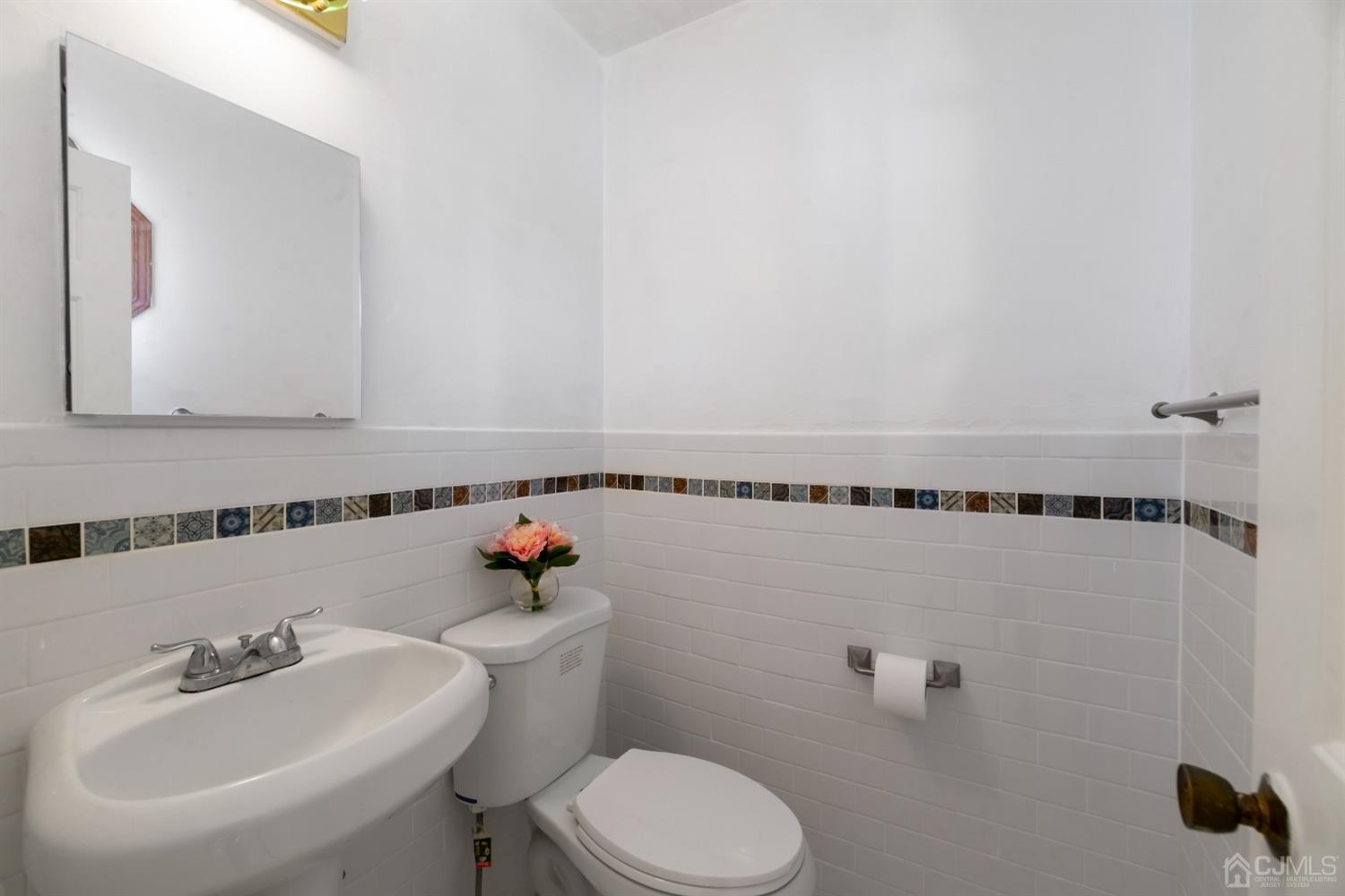 7 Prescott Road East Brunswick, NJ 08816 - Photo 12 of 30 a bathroom with a sink mirror and toilet