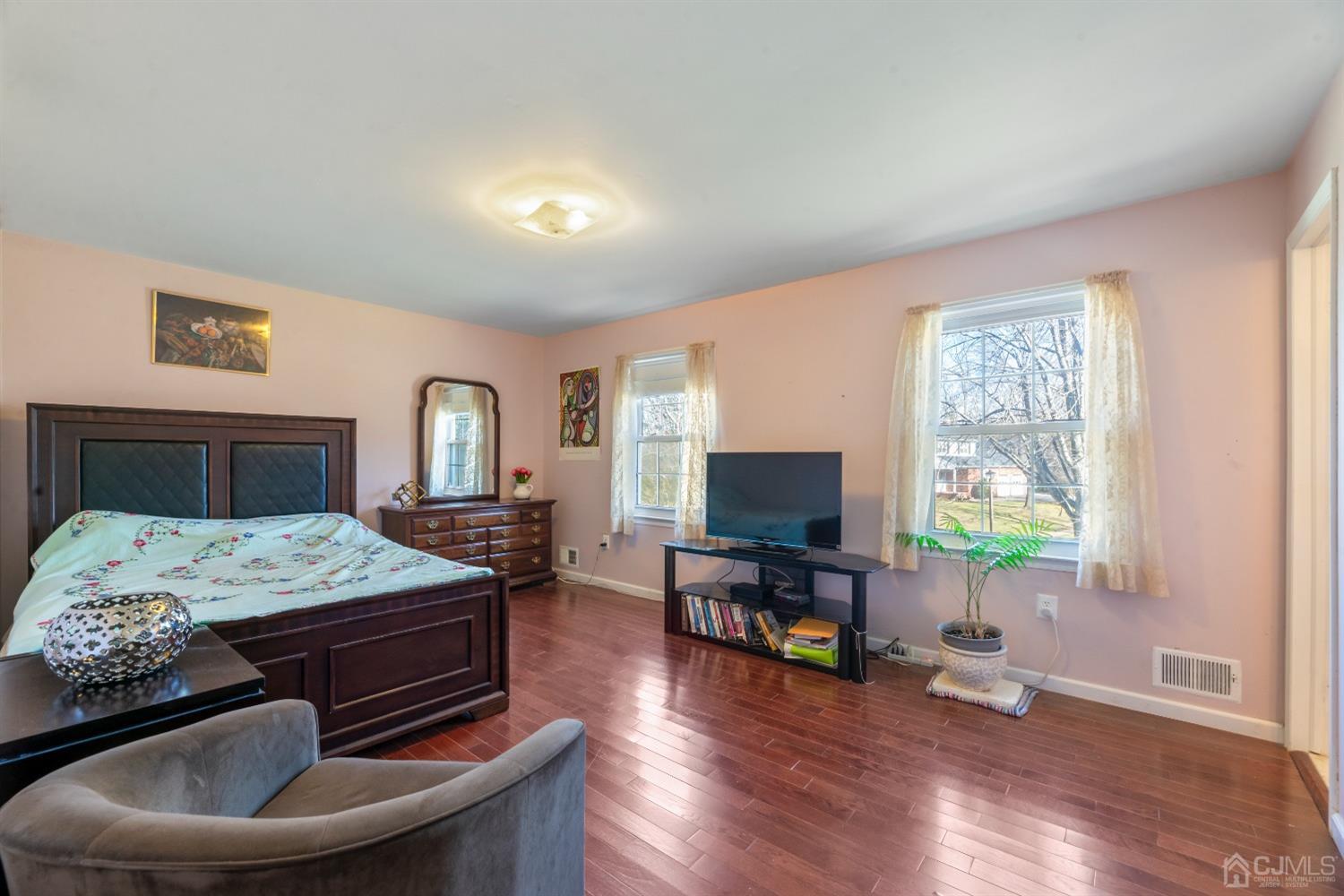 7 Prescott Road East Brunswick, NJ 08816 - Photo 13 of 30 a room with furniture and a flat screen tv