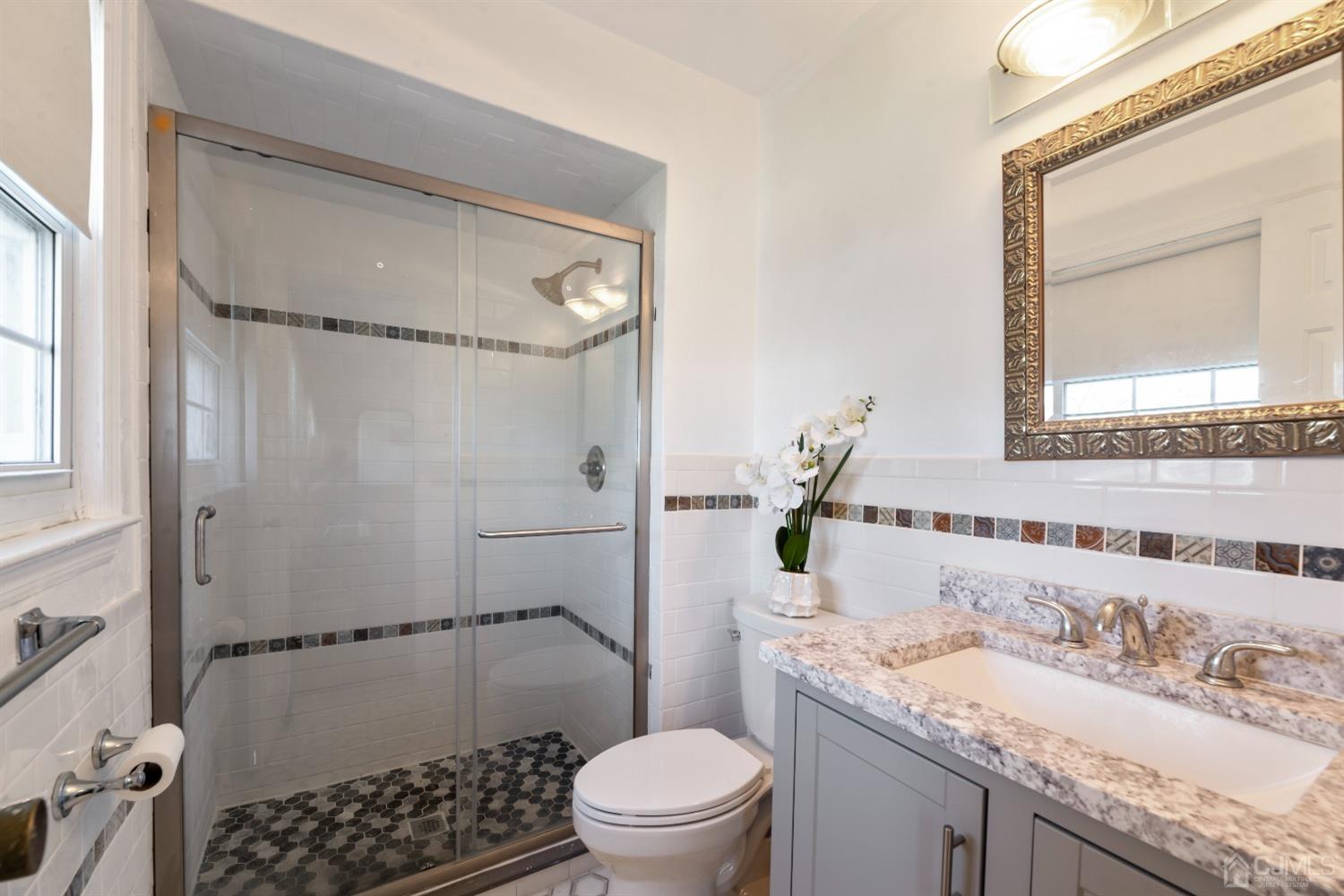 7 Prescott Road East Brunswick, NJ 08816 - Photo 14 of 30 a bathroom with a granite countertop sink toilet and shower