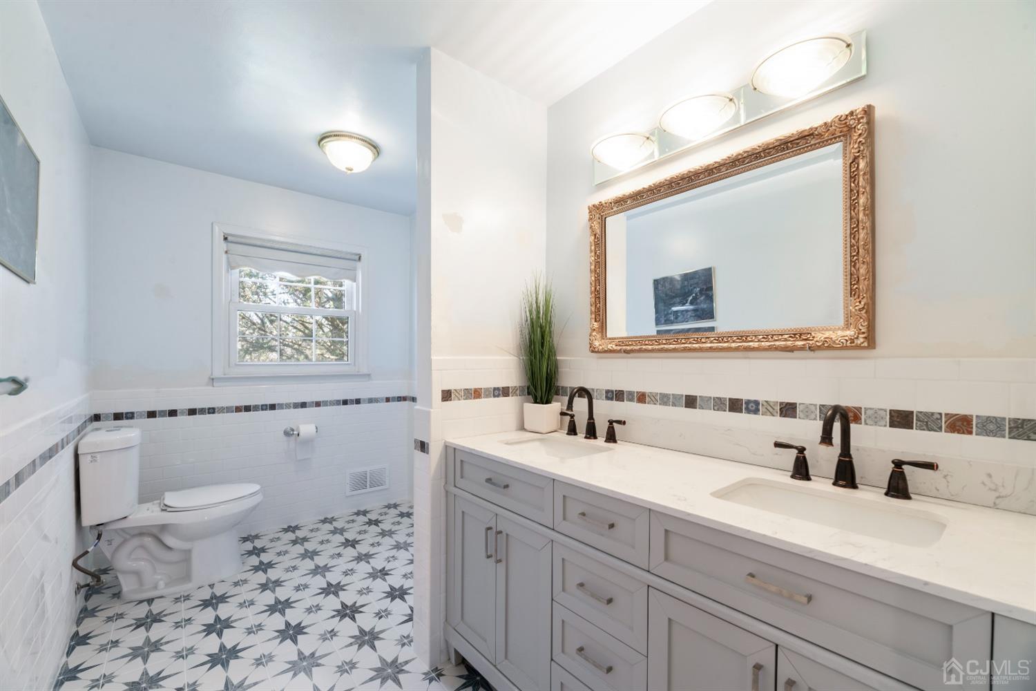 7 Prescott Road East Brunswick, NJ 08816 - Photo 17 of 30 a bathroom with a sink a toilet a mirror and shower