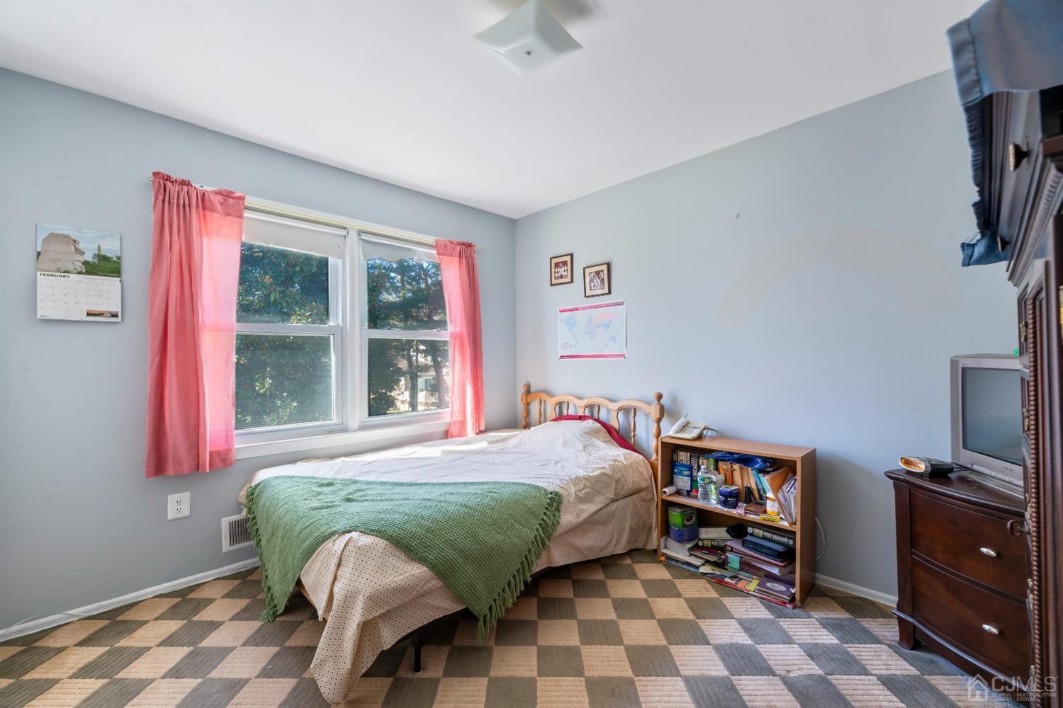 7 Prescott Road East Brunswick, NJ 08816 - Photo 19 of 30 a bedroom with a bed and a window