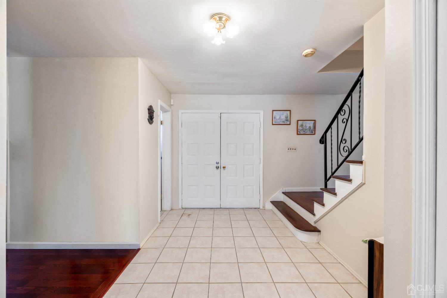 7 Prescott Road East Brunswick, NJ 08816 - Photo 4 of 30 a view of an entryway with stairs