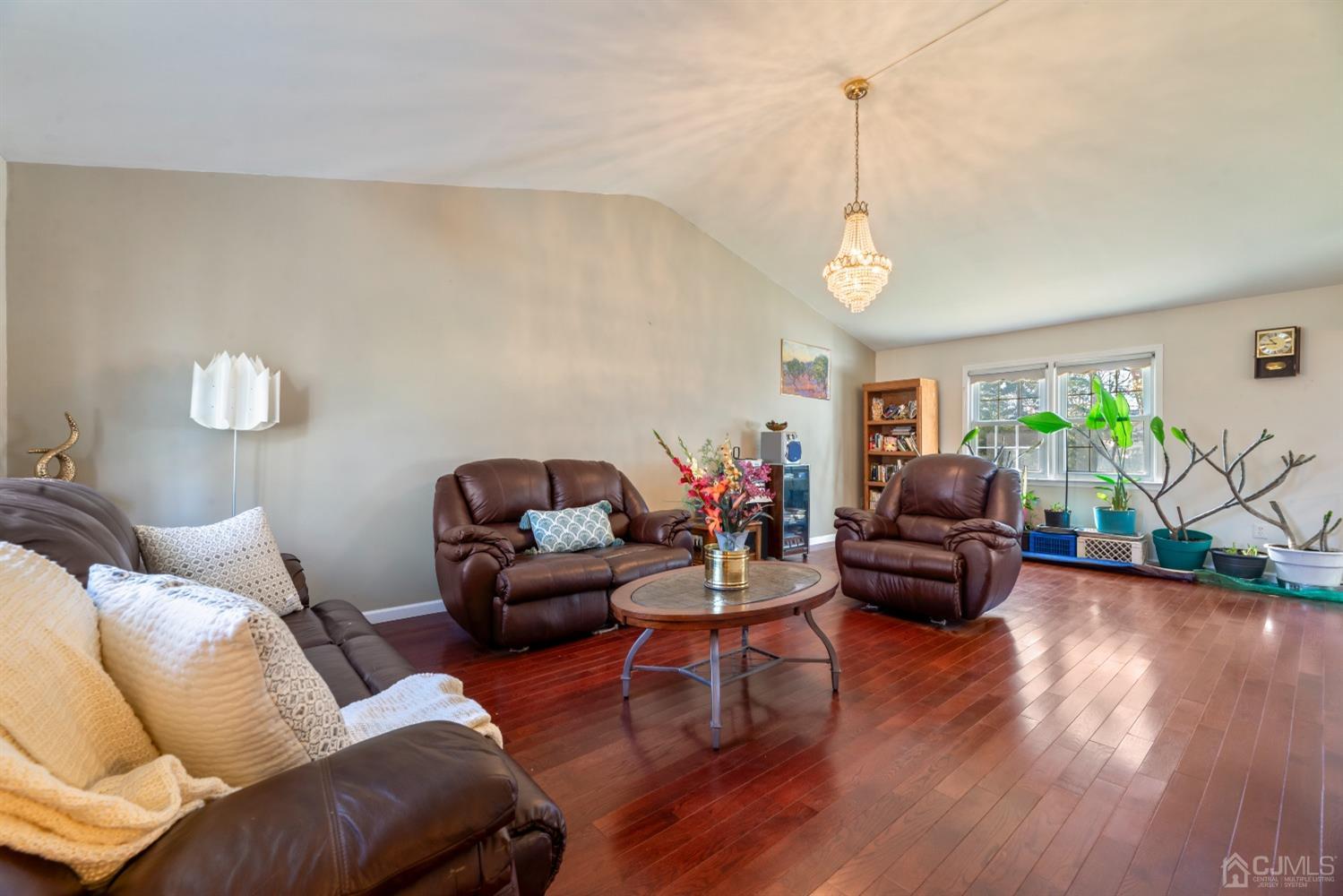 7 Prescott Road East Brunswick, NJ 08816 - Photo 5 of 30 a living room with furniture a couch and wooden floor